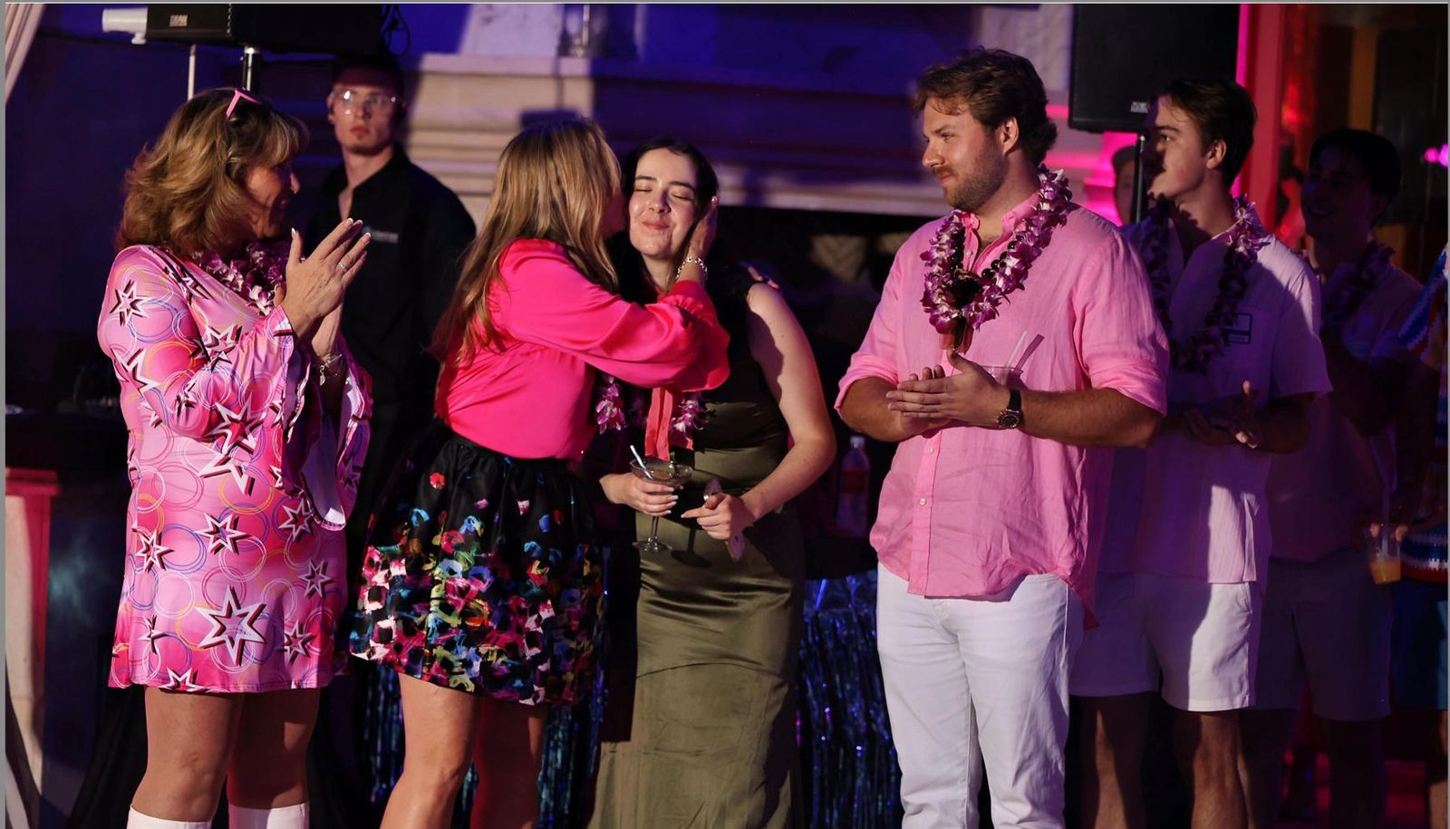 Guests in Barbie-themed outfits at the Barbie Land Party